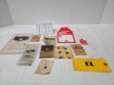 Several IH plastic bags paper bags and sales sign