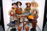 Collection of Byers Choice Harvest Carolers and Table. Each Caroler retails between 40-80 dollars ea