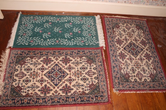 Three small area rugs