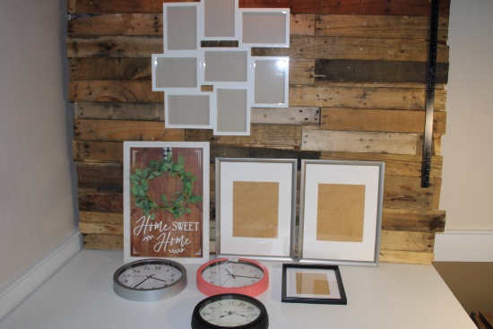 Assortment of wall clocks, picture frames and wall decorations