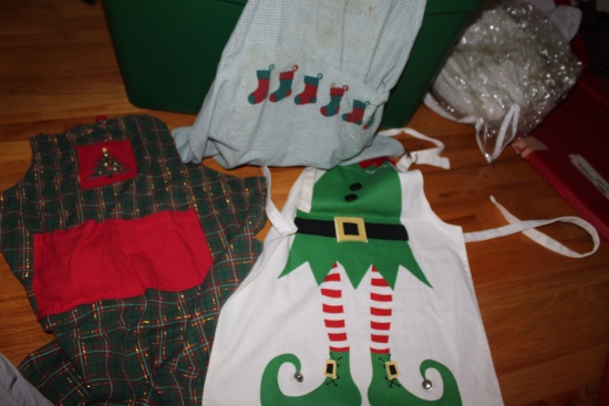 Tote containing Christmas aprons, runners, and other items