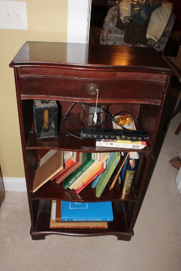 Shelf with contents/books.