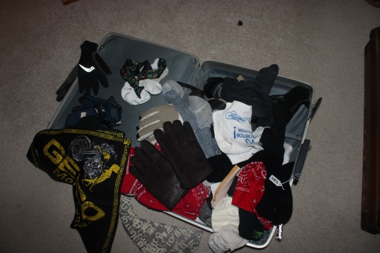 Suitcase  full of socks, gloves and winter gear.