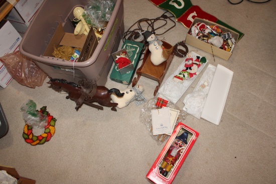 Tote full of Christmas ornaments, lights and other holiday items.