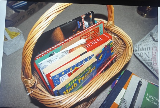 Basket containing magazines, books, bibles and more.