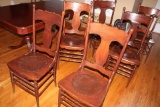 Six Antique Oak dining chairs with leather insert.