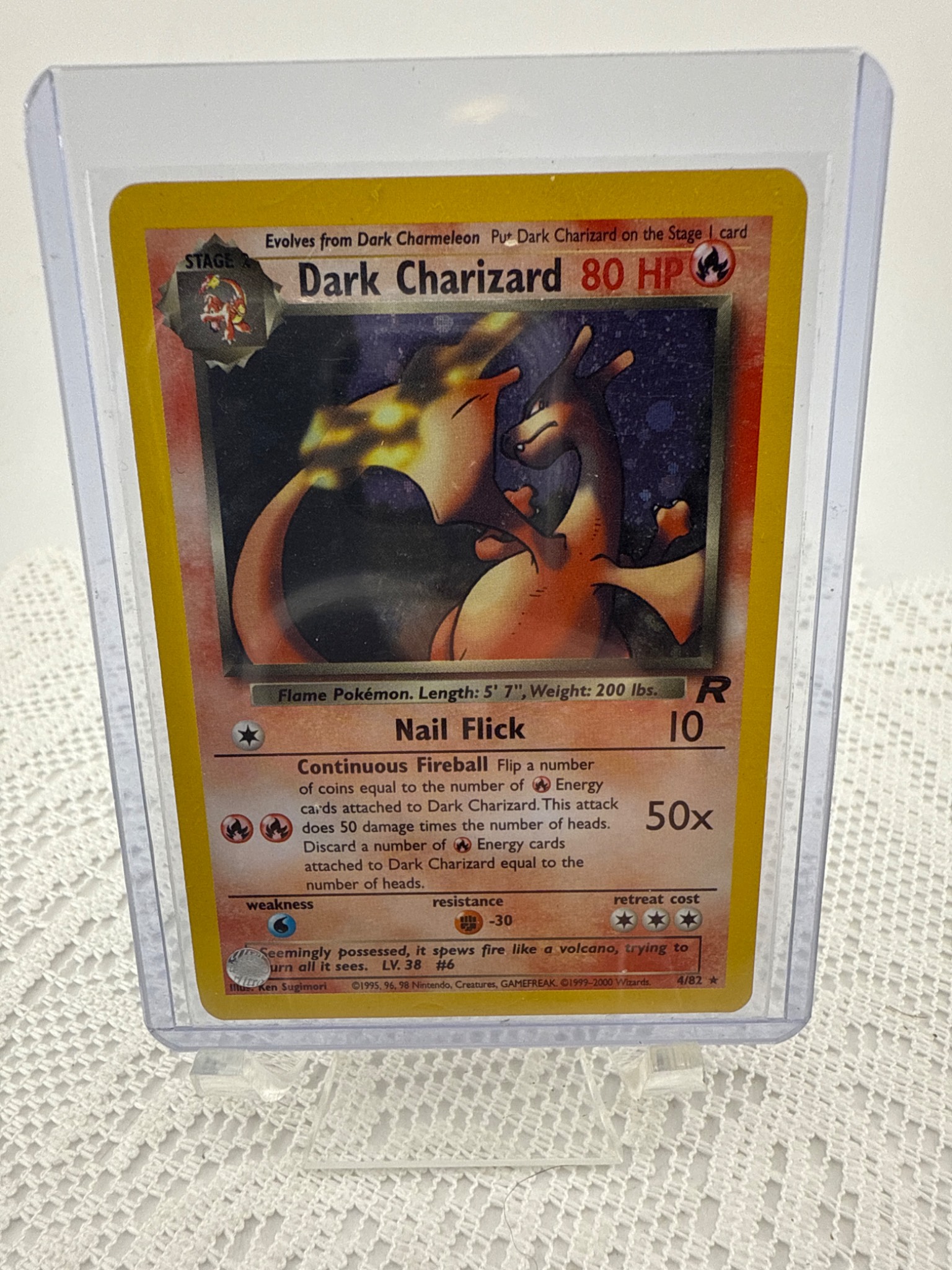pokemon team rocket dark charizard card 4/82 this PSA 8 card is the perfect way to showcase your collection. Pokemon Team Rocket Dark Charizard