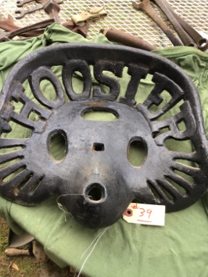 Vintage cast-iron tractor or implement seat, "Hoosier"
