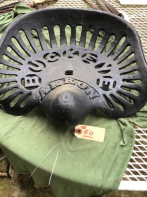 Vintage cast-iron tractor or implement seat, "Buckeye"