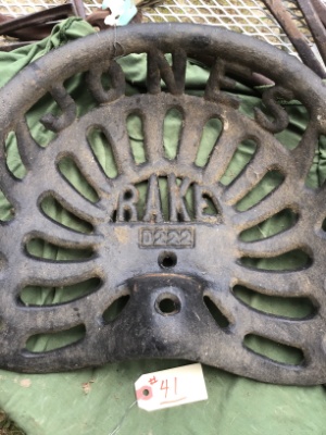 Vintage cast-iron tractor or implement seat, "Jones Rake"