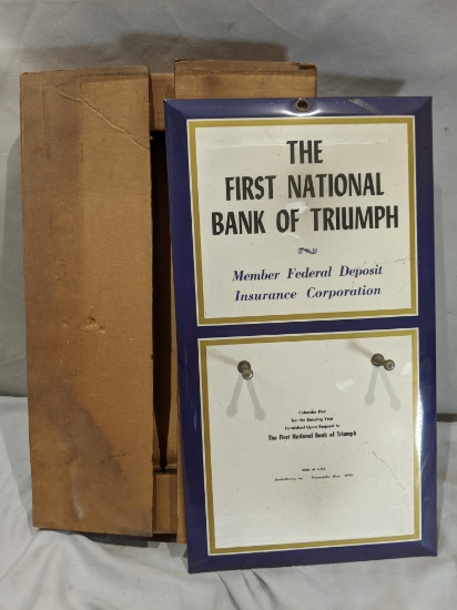NOS First National Bank of Triumph Wall Calendar Sign