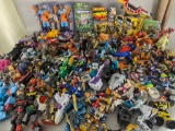 Huge Lot of Assorted Action Figures and Toys Including Transformers and Space Jam