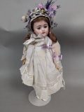 Porcelain Doll with Victorian-Style Outfit and Ribbon Accents