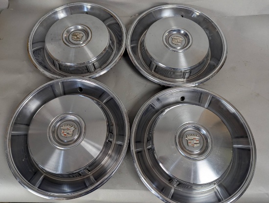 Four 1960s Cadillac Hubcaps with Crest Center Design