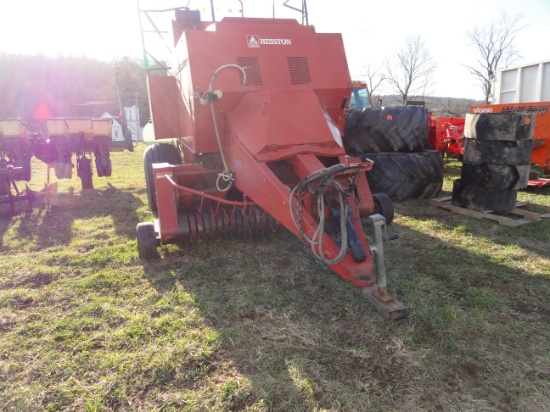 Heston 4755 inline large square baler.  Makes a 3 x 3  bale.