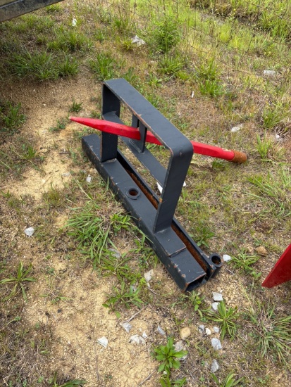 Tag # 0741  Hay spear that attaches to tractor/ skidsteer bucket