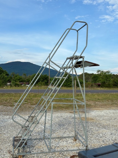 Tag # 2202  Industrial warehouse ladder w/ casters and stabilizing brake