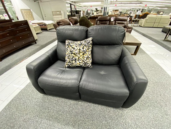 Black loveseat with electronic recliners