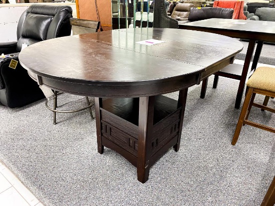 Oval dark wood dining table