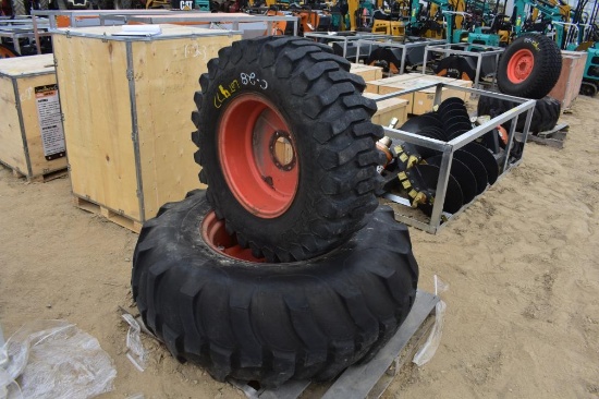 2 Kubota tires on rims, unmatched tread