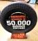 Atlas tire holder and advertising sign