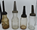 (4) 1 quart glass oil bottles and spouts,