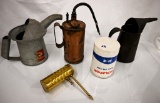 (4) oil cans and a fuel filter
