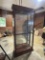 Elegant Mahogany Glass Curio Cabinet with Dentil Crown Molding and Mirror Back