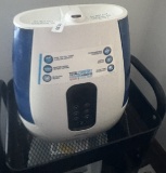 Air purifier on wheeled cart