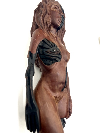 Wooden sculpture of a Neanderthal Woman Cyborg