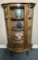 Antique Oak Curved Curio Cabinet With Carved Lions Head Accents