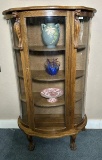 Antique Oak Curved Curio Cabinet With Carved Lions Head Accents