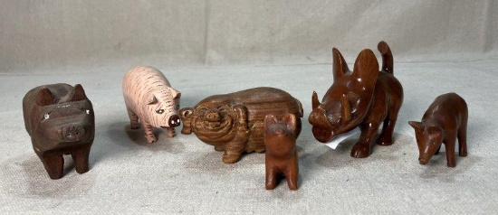 Six Carved Wooden Pig Figures