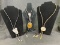 Group of Four Western Bolo Ties Featuring Leather, Snake Skin, and Mixed Metal