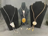 Group of Four Western Bolo Ties Featuring Leather, Snake Skin, and Mixed Metal
