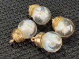 Group of Four Opal Pendants with Suspended Opal Particles
