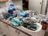 Bathroom Counter Contents: Shampoo, Band-Aids, Hair Straighteners, and More