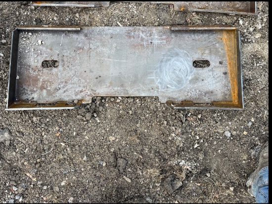 Skid steer attachment plate
