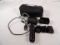 GOPRO KIT INCLUDING CAMERA, SLEEVE, HANDLE, AND CARRYING CASE.