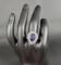 SILVER CZ RING WITH BLUE TEARDROP SHAPED STONE