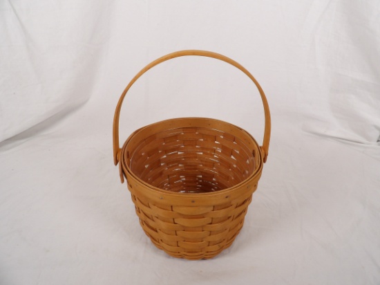 1997 LONGABERGER ROUND BASKET WITH SWING HANDLE