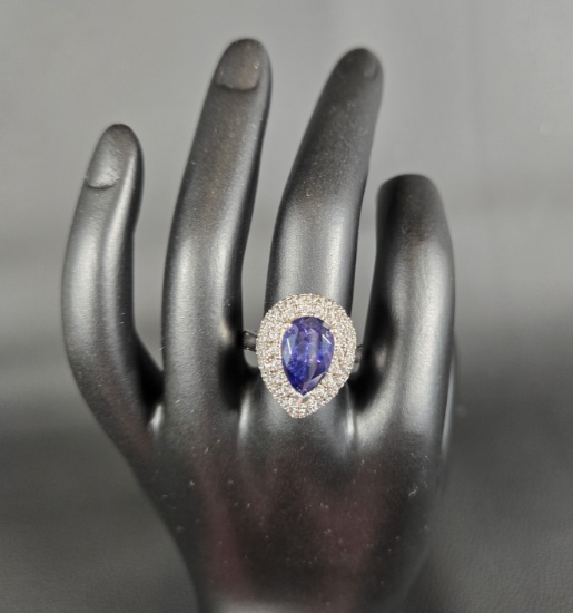SILVER CZ RING WITH BLUE TEARDROP SHAPED STONE