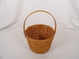 1997 LONGABERGER ROUND BASKET WITH SWING HANDLE
