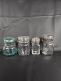 LOT OF (4) SMALL VINTAGE GLASS JARS WITH GLASS LIDS AND WIRE CLOSURES
