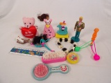 LOT OF (12) GIRL TOYS INCLUDING BRACELET, FIGURINES, BRUSH, ETC