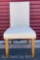 BEIGE UPHOLSTERY ARMLESS DINING CHAIR W NAILHEAD TRIM AND RUBBERWOOD LEGS 19? X 20? H38.5?