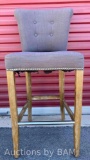 GREY UPHOLSTERY COUNTER HEIGHT ARMLESS CHAIR W NAIL TRIM & WOOD LEGS 19? X 19? H42.5?