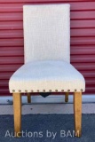 BEIGE UPHOLSTERY ARMLESS DINING CHAIR W NAILHEAD TRIM AND RUBBERWOOD LEGS 19? X 20? H38.5?