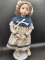 Brown Haird Doll on Stand