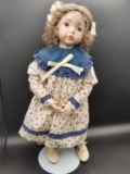 Brown Haird Doll on Stand